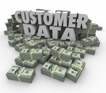 Customer Data in 3d letters and words surrounded by stacks and piles of money earned from sales and marketing to client database